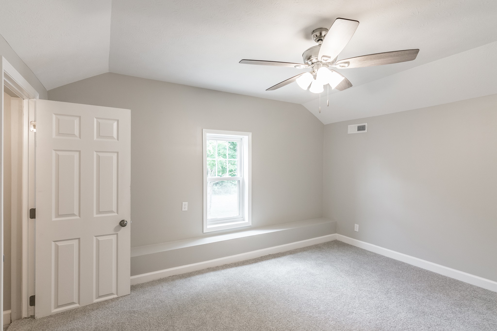 1267 Smiley Troutt Road Bethpage, TN 37022 - Photo 27 of 34 an empty room with a window and a fan