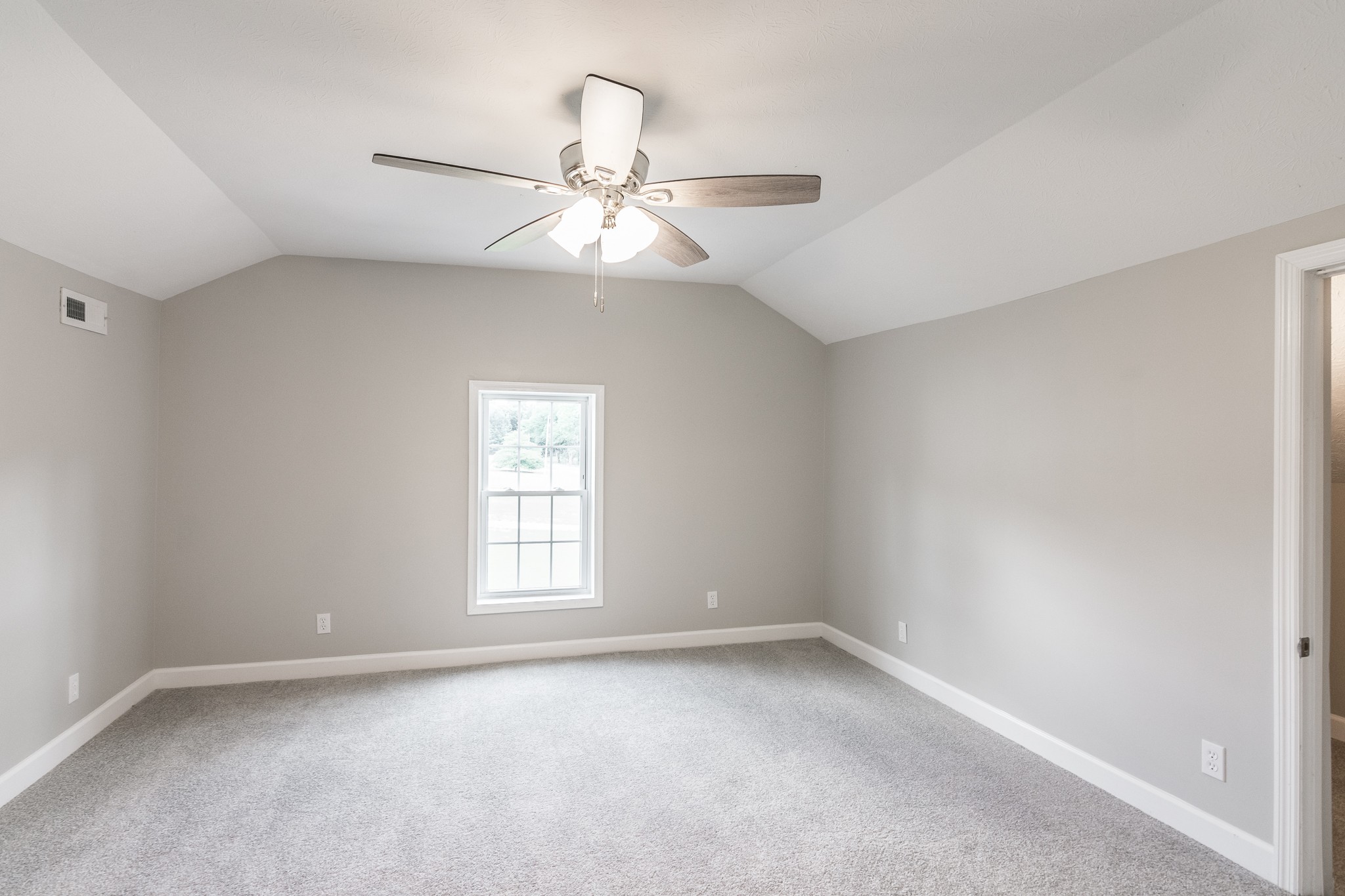 1267 Smiley Troutt Road Bethpage, TN 37022 - Photo 29 of 34 an empty room with a window and a fan