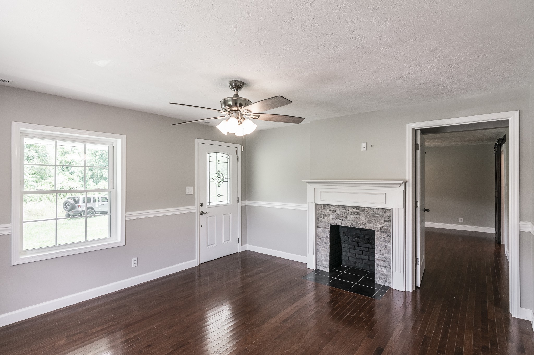 1267 Smiley Troutt Road Bethpage, TN 37022 - Photo 4 of 34 a view of an empty room with wooden floor and a window