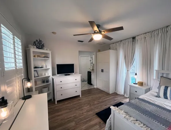 a bed room with a bed and a chandelier