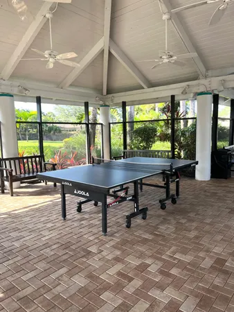 a view of swimming pool with outdoor seating and plants
