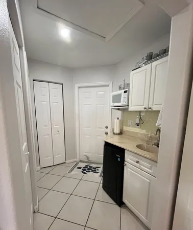a bedroom with bed and flat screen tv