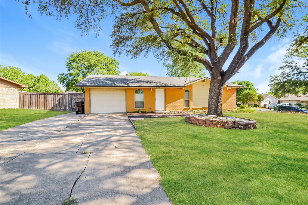 1705 Abbey Road Plano, TX 75074 - Photo 1 of 1 a view of a house with backyard and a tree