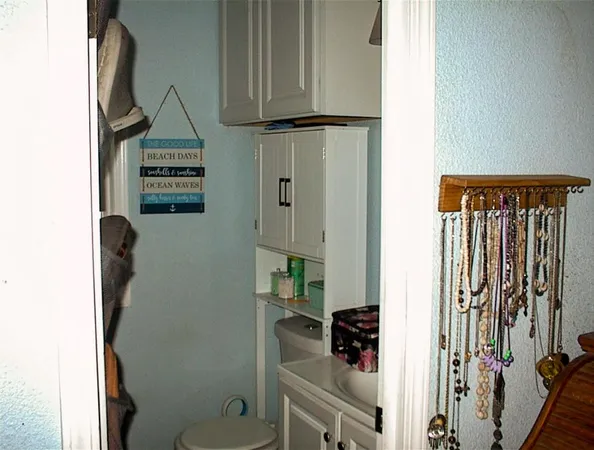 a bathroom with a shower a toilet and a sink