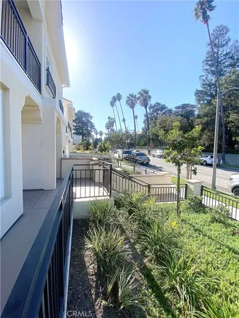 a view of balcony with outdoor seating and city view