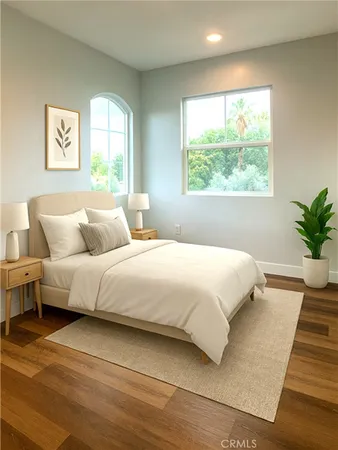 a bedroom with a large bed and a window