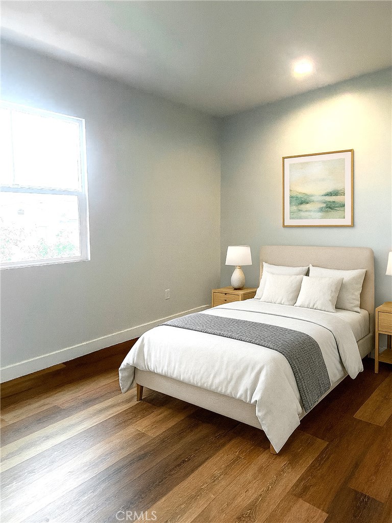 300 East Alhambra Road, Unit F Alhambra, CA 91801 - Photo 7 of 20 a bedroom with a bed and wooden floor