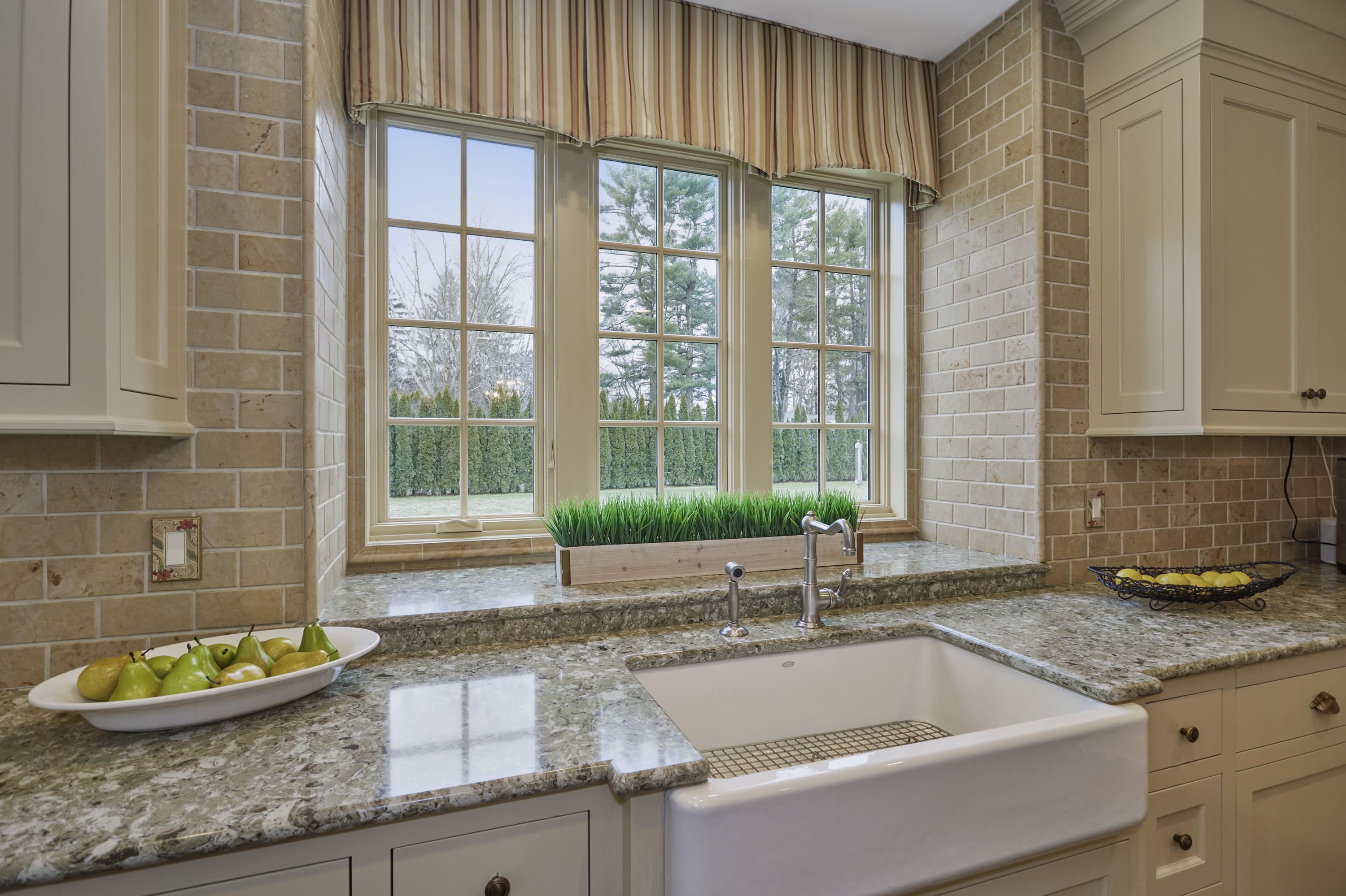 366 Brookside Road Darien, CT 06820 - Photo 14 of 40 a large kitchen with granite countertop a sink and a window