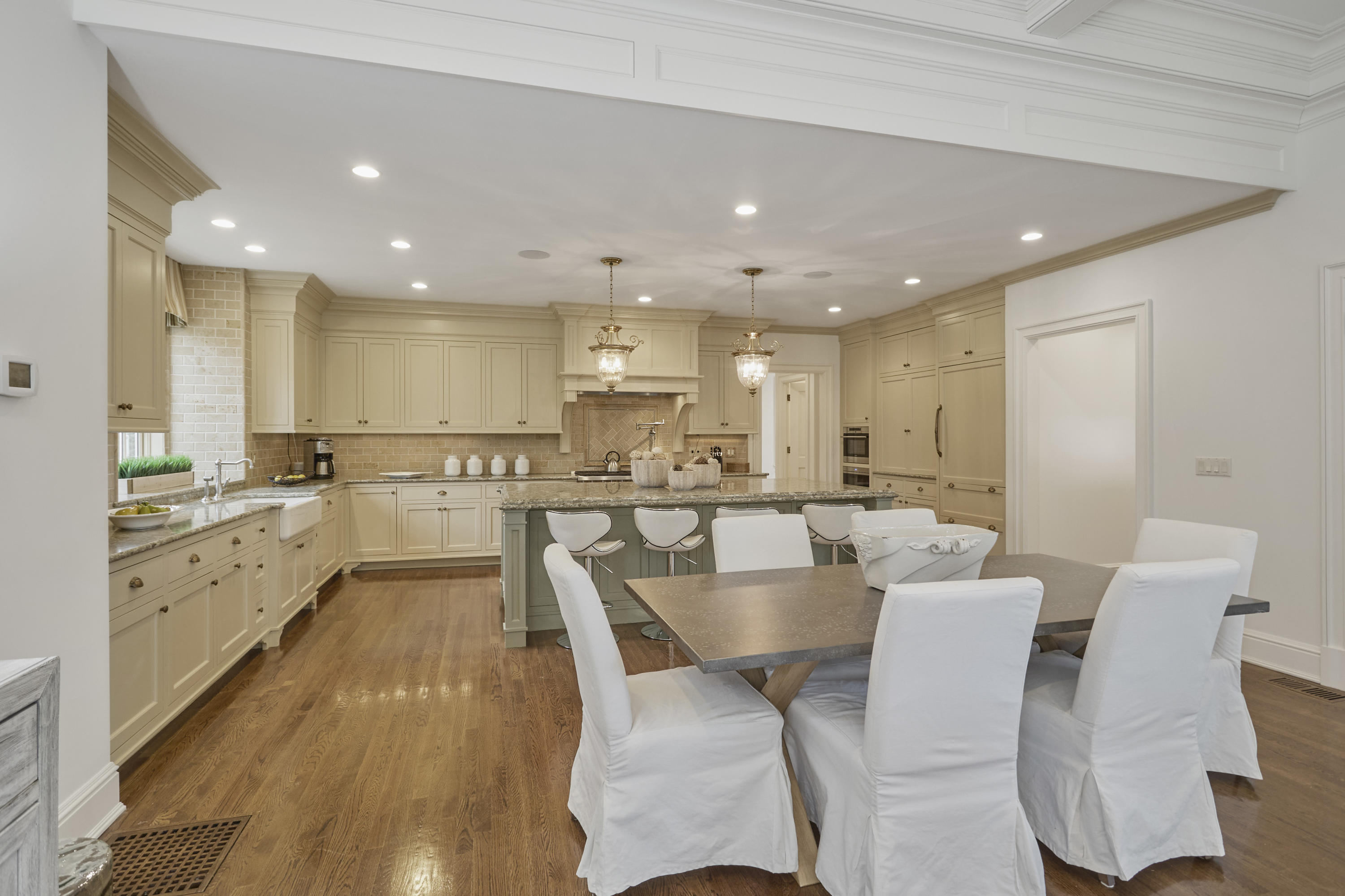 366 Brookside Road Darien, CT 06820 - Photo 15 of 40 a large kitchen with cabinets table and chairs