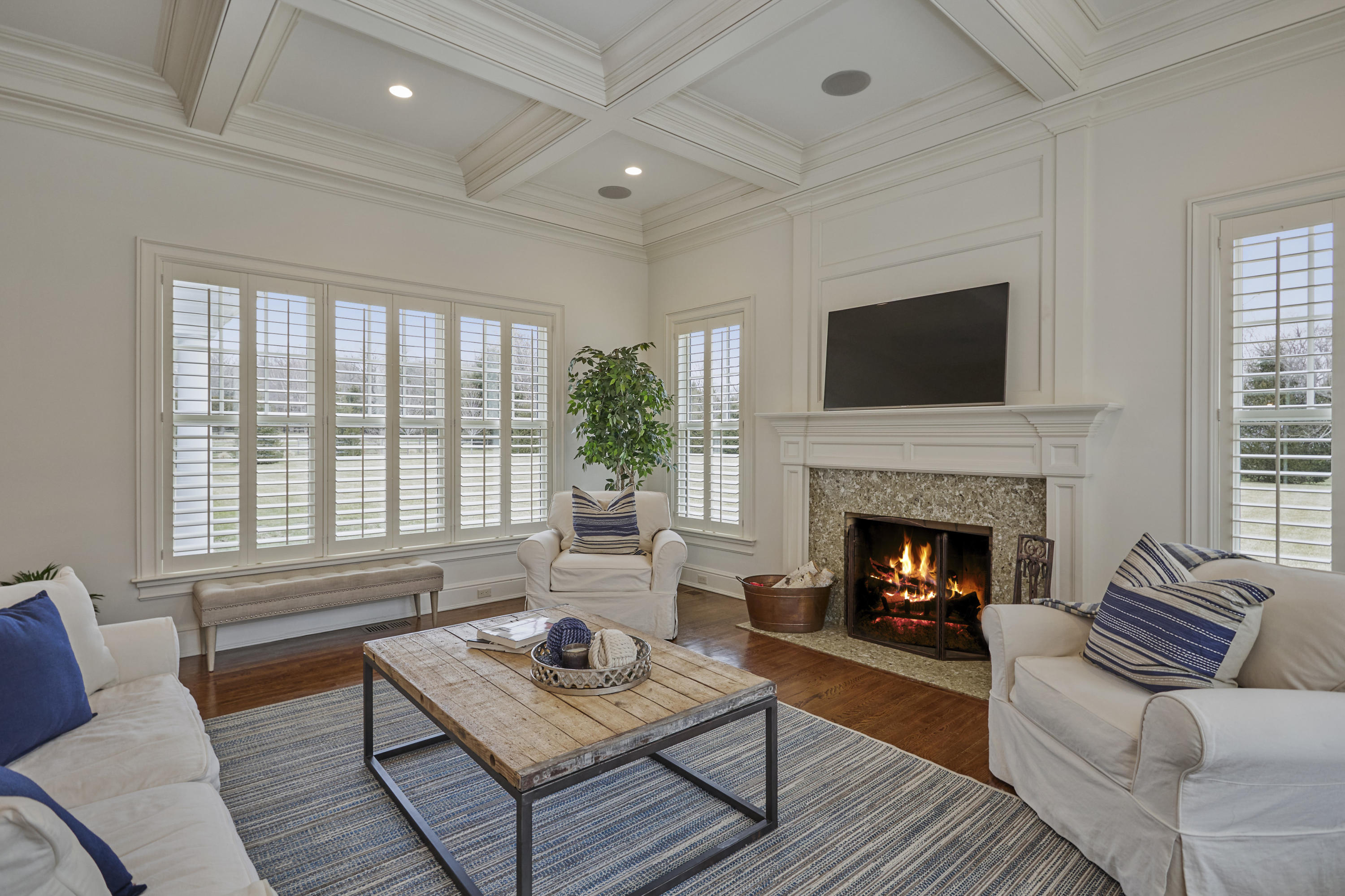 366 Brookside Road Darien, CT 06820 - Photo 17 of 40 a living room with furniture a flat screen tv and a fireplace