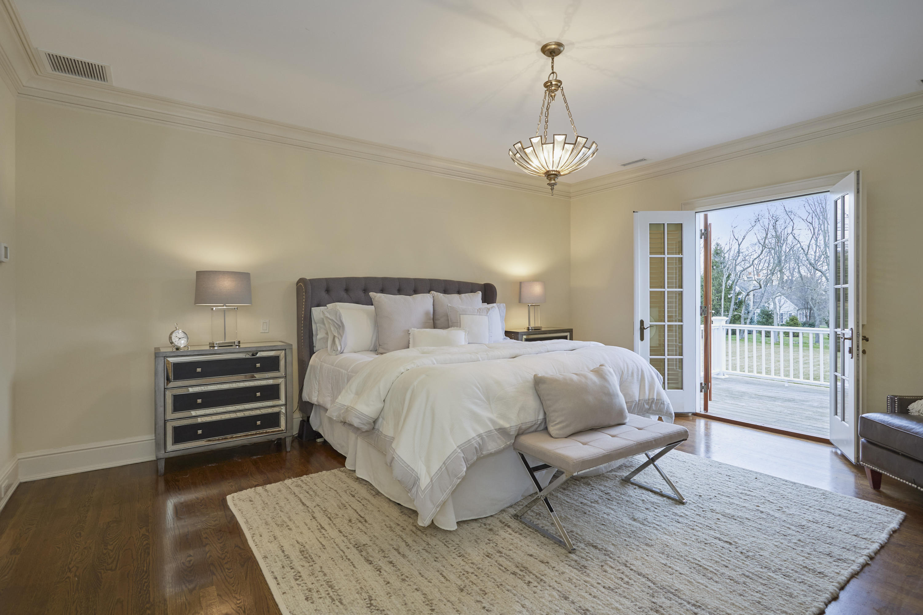 366 Brookside Road Darien, CT 06820 - Photo 20 of 40 a bedroom with a bed wooden floor and window