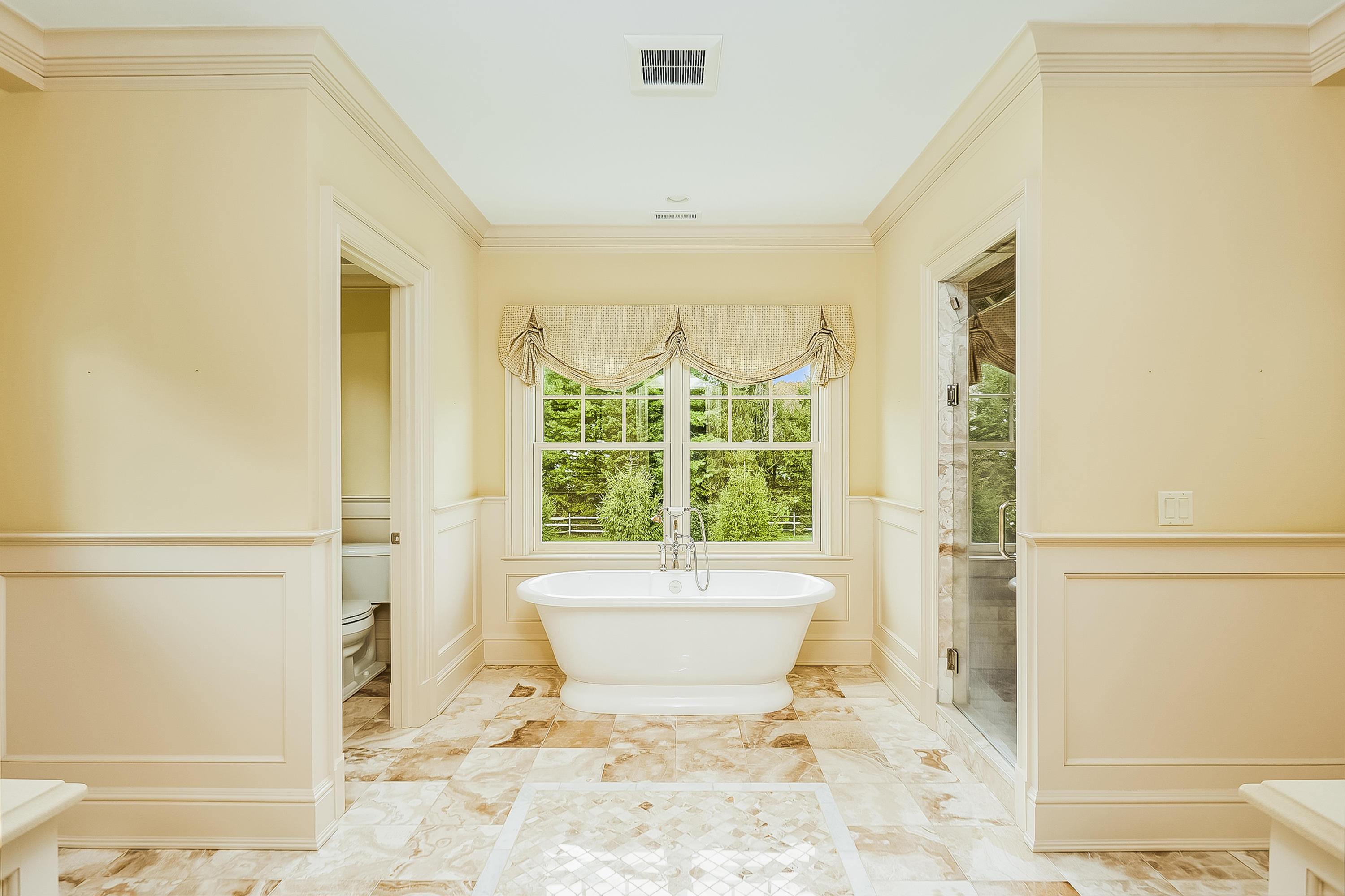 366 Brookside Road Darien, CT 06820 - Photo 21 of 40 a bathroom with a bathtub and a shower