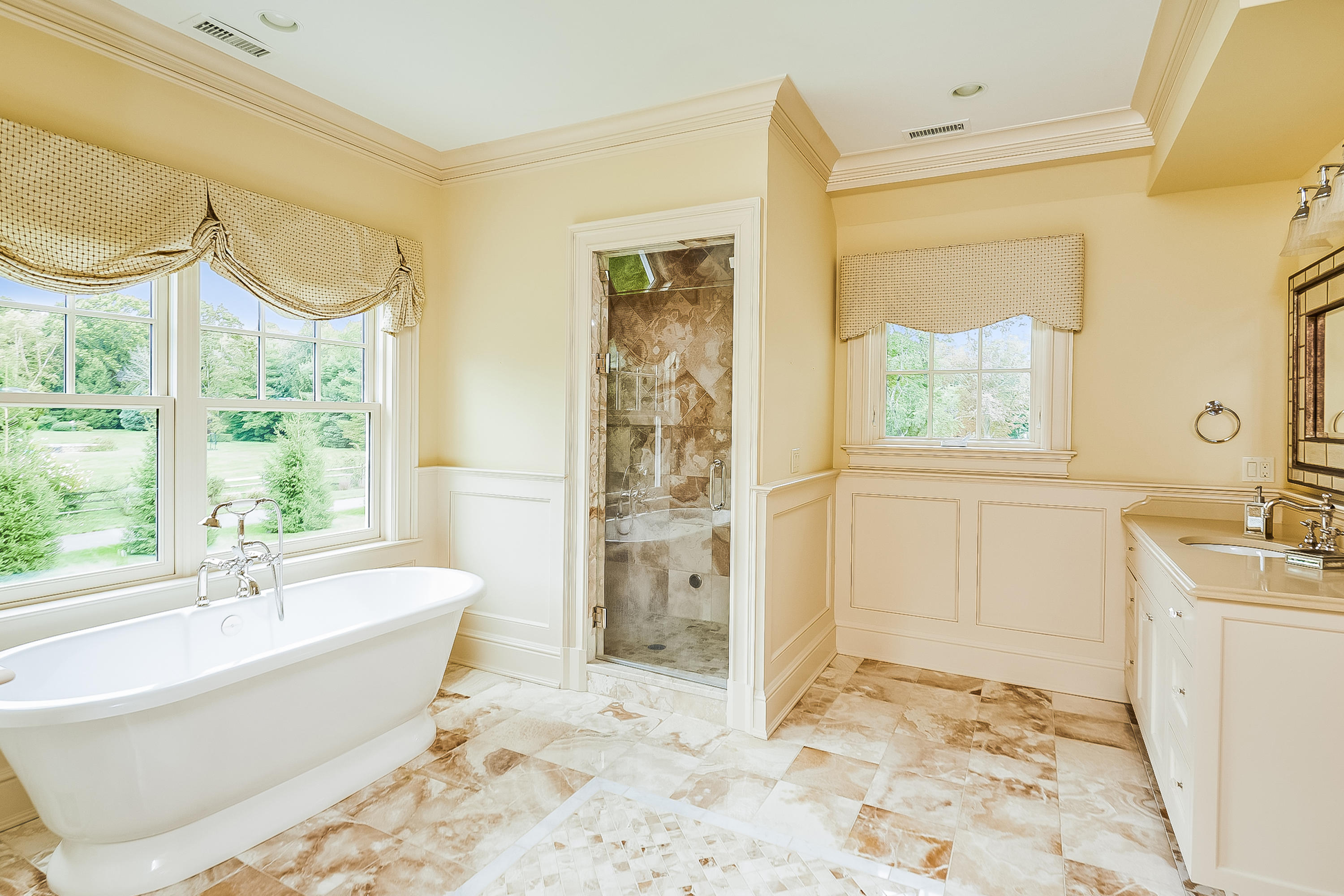 366 Brookside Road Darien, CT 06820 - Photo 22 of 40 a spacious bathroom with a tub sink and a shower