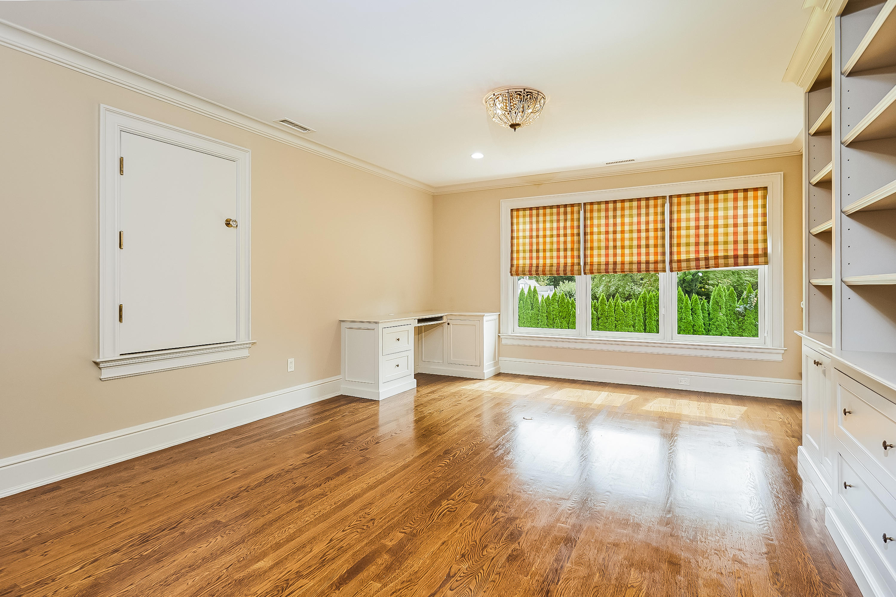 366 Brookside Road Darien, CT 06820 - Photo 23 of 40 a view of empty room with wooden floor and fan