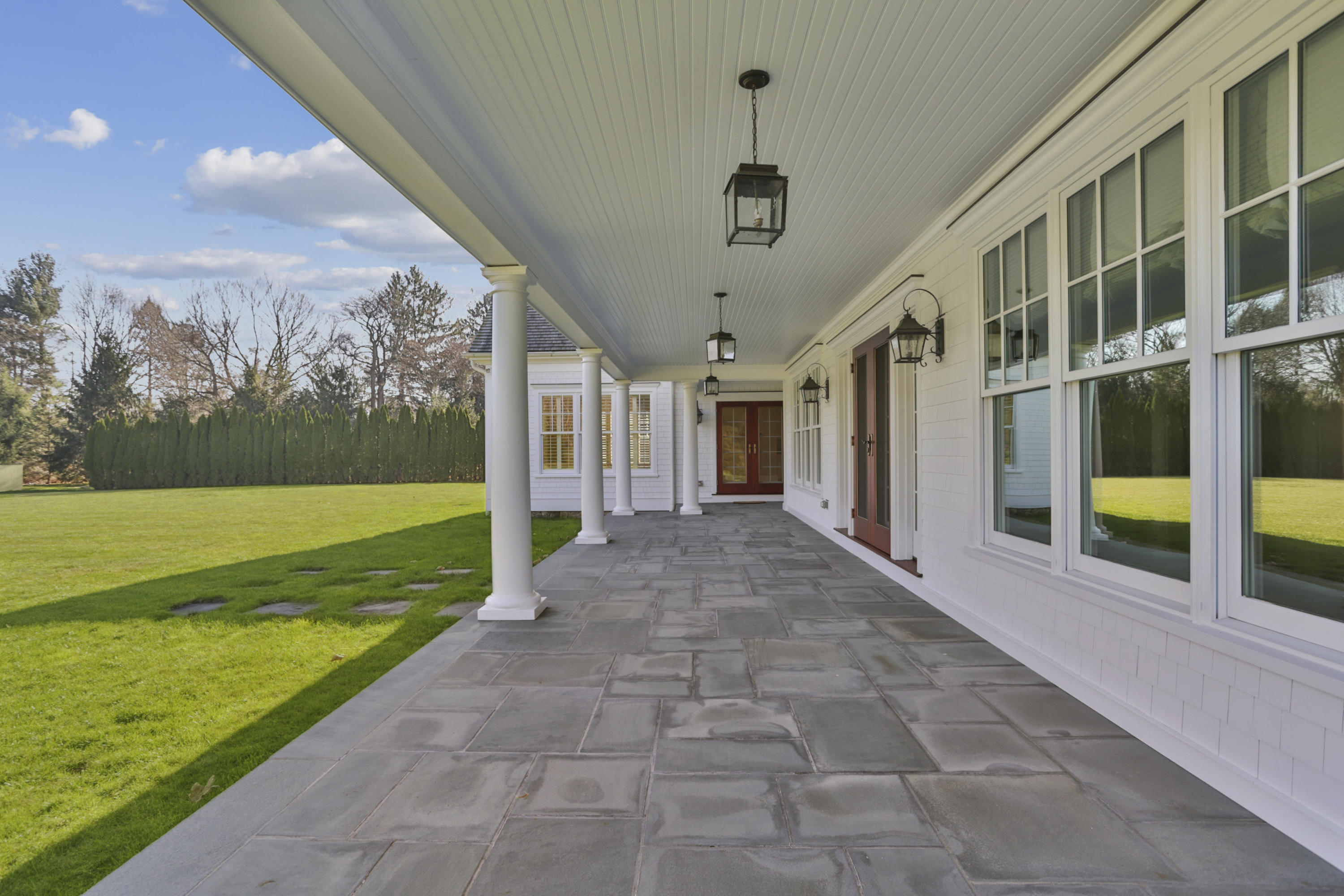 366 Brookside Road Darien, CT 06820 - Photo 31 of 40 a view of a porch with a yard