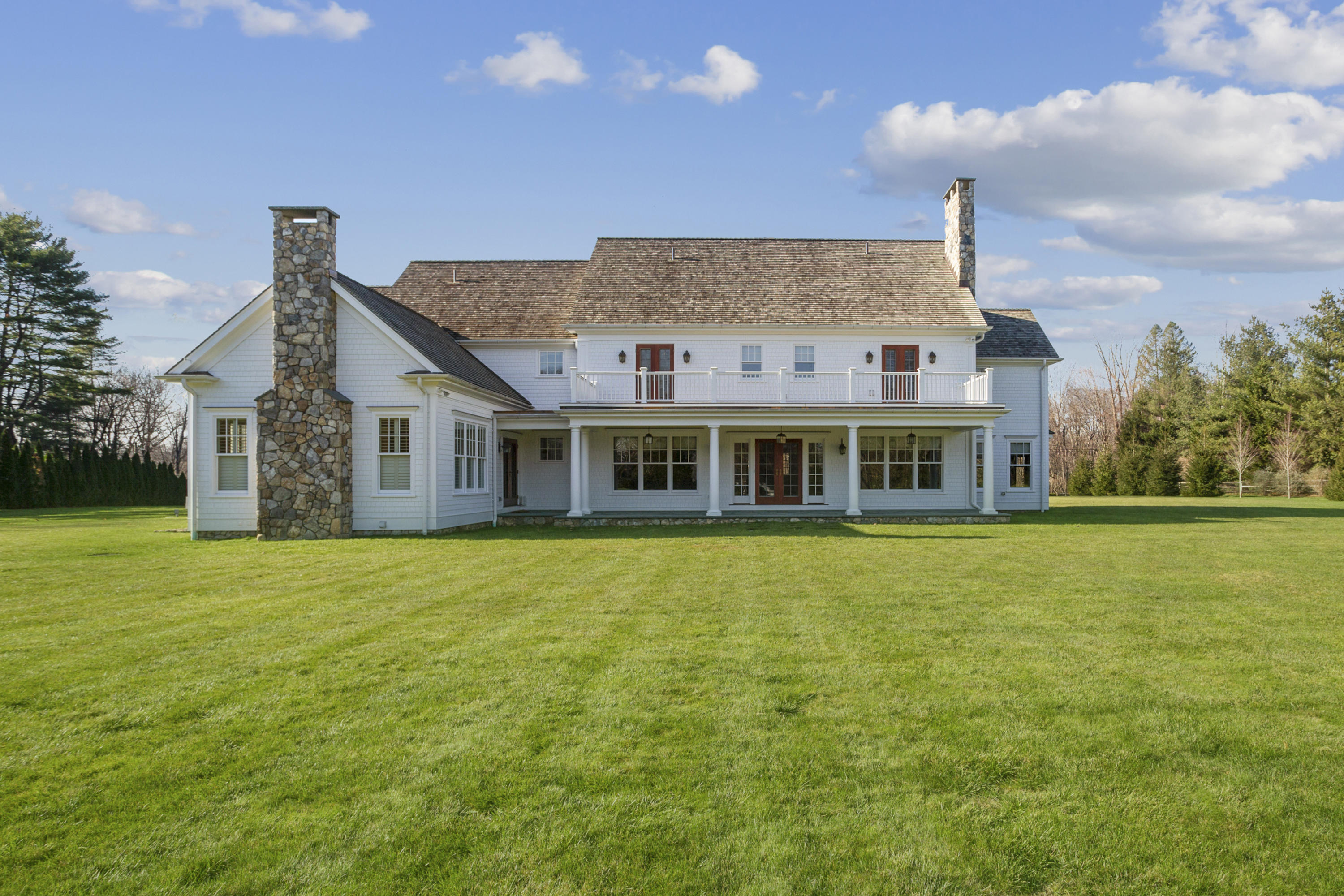 366 Brookside Road Darien, CT 06820 - Photo 32 of 40 a front view of a house with a garden