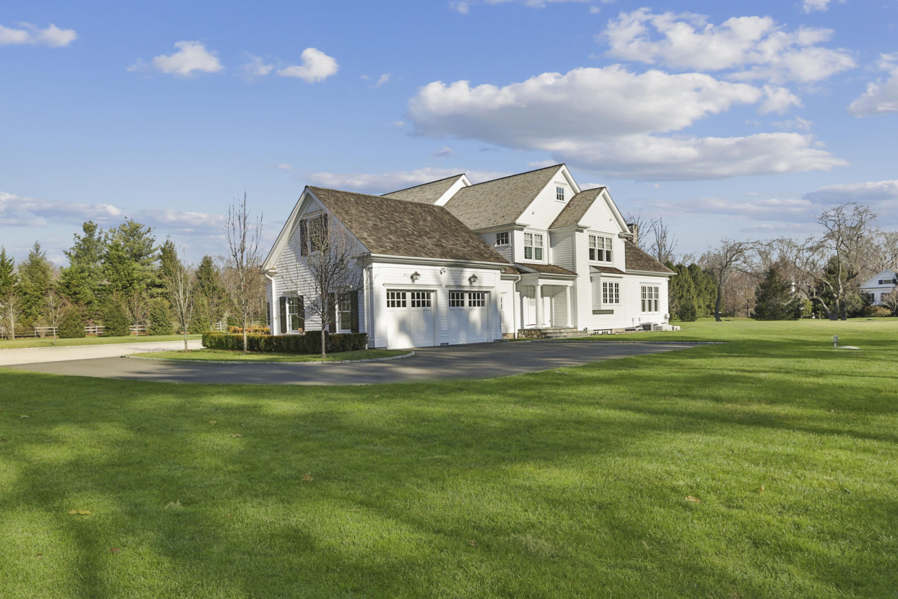 366 Brookside Road Darien, CT 06820 - Photo 33 of 40 a front view of a house with a garden