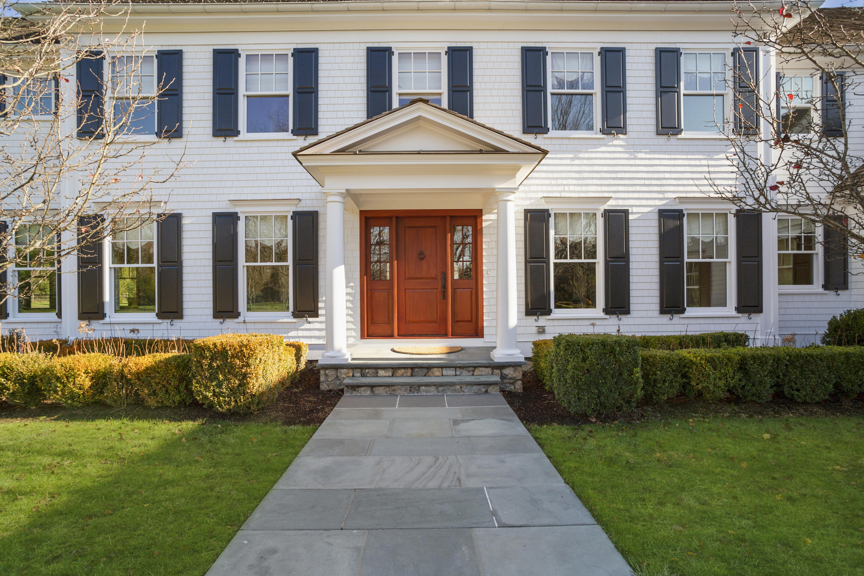 366 Brookside Road Darien, CT 06820 - Photo 5 of 40 a front view of a house with a garden