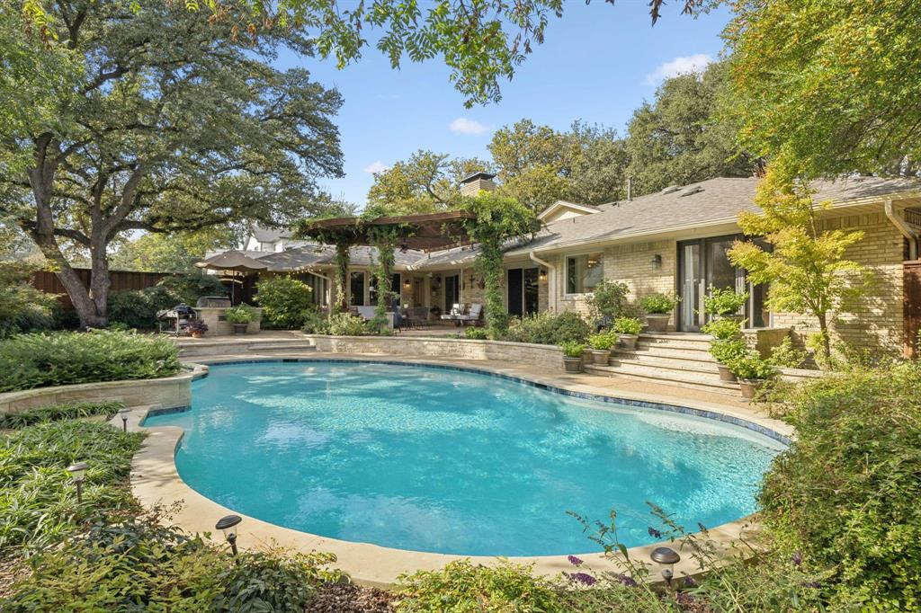 4708 Sugar Mill Road Dallas, TX 75244 - Photo 11 of 23 a swimming pool with outdoor seating and yard
