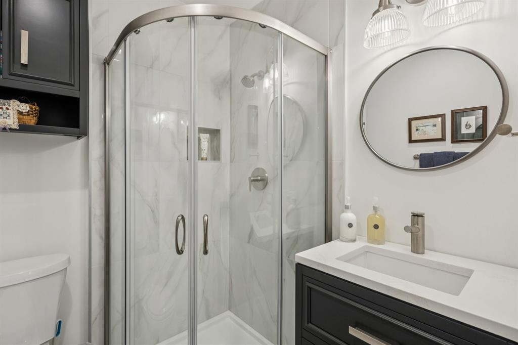 4708 Sugar Mill Road Dallas, TX 75244 - Photo 12 of 23 a bathroom with a sink a toilet and shower