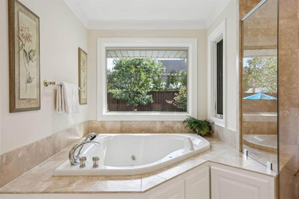 4708 Sugar Mill Road Dallas, TX 75244 - Photo 16 of 23 a bath tub sitting next to a window