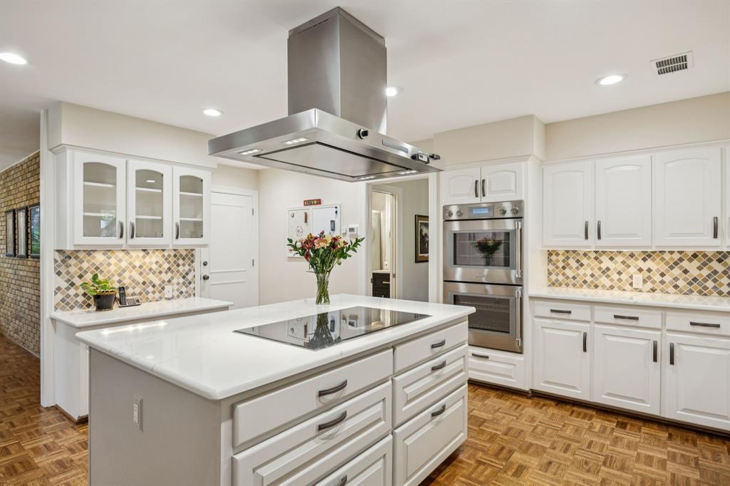 4708 Sugar Mill Road Dallas, TX 75244 - Photo 5 of 23 a kitchen with stainless steel appliances kitchen island granite countertop a sink and cabinets