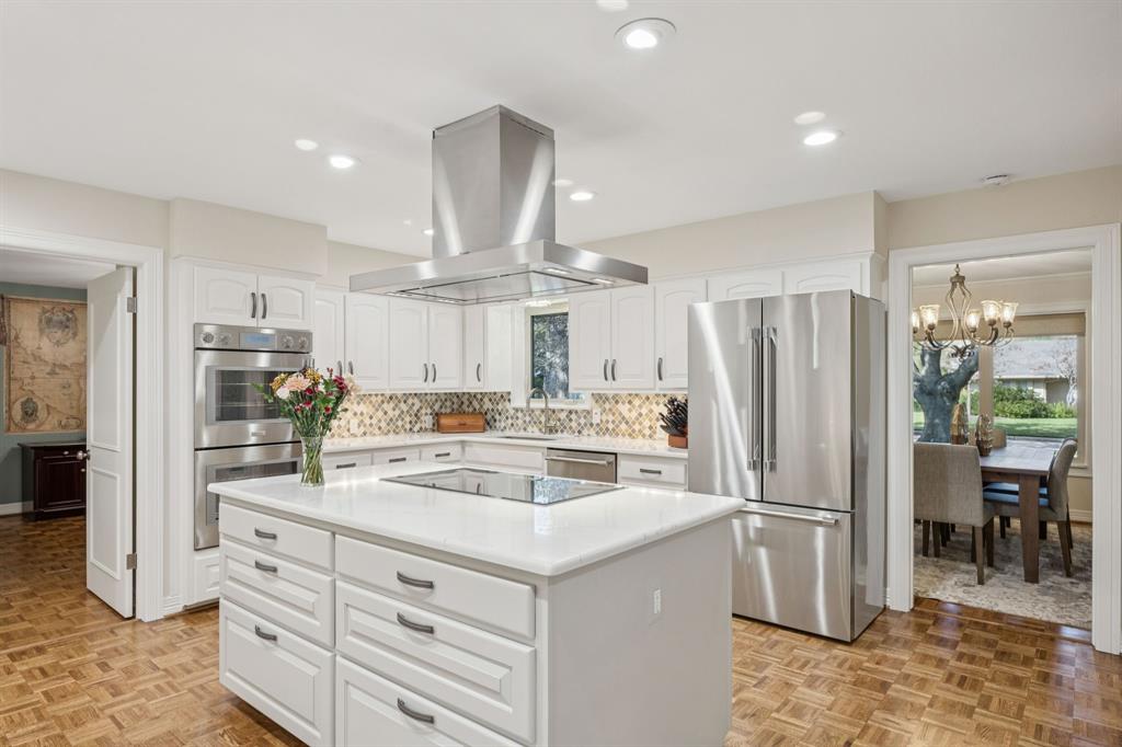 4708 Sugar Mill Road Dallas, TX 75244 - Photo 7 of 23 a kitchen with a refrigerator a stove a sink and a refrigerator