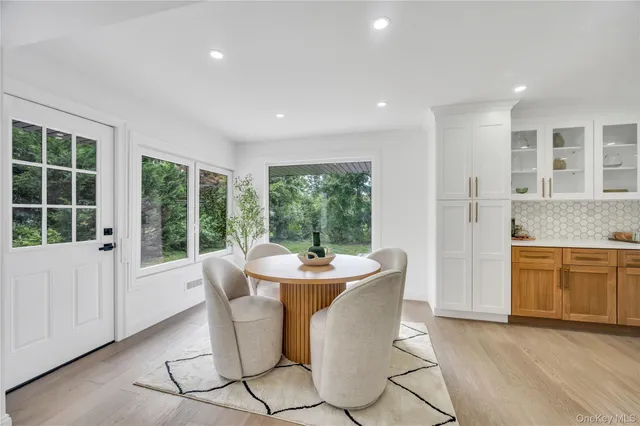 a dining room with furniture window wooden floor