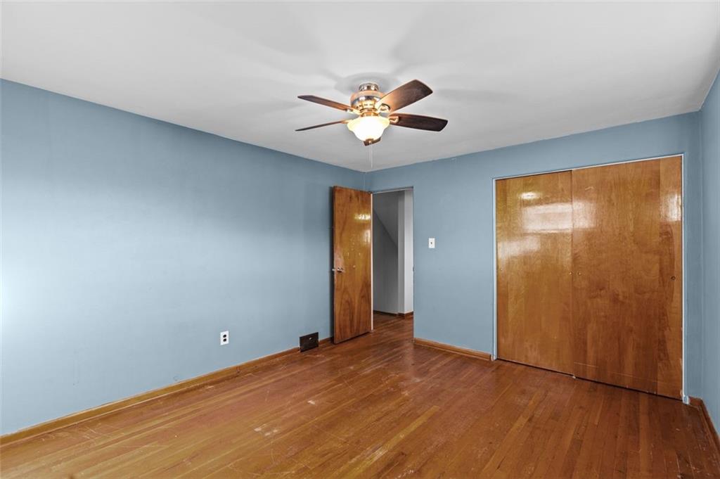 1210 Linden Street Cheswick, PA 15024 - Photo 12 of 31 wooden floor in an empty room with a window