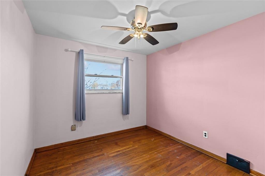 1210 Linden Street Cheswick, PA 15024 - Photo 15 of 31 a view of a room with wooden floor and a ceiling fan