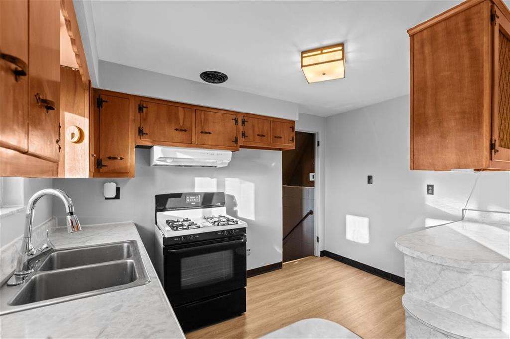 1210 Linden Street Cheswick, PA 15024 - Photo 7 of 31 a kitchen with a sink cabinets and stainless steel appliances