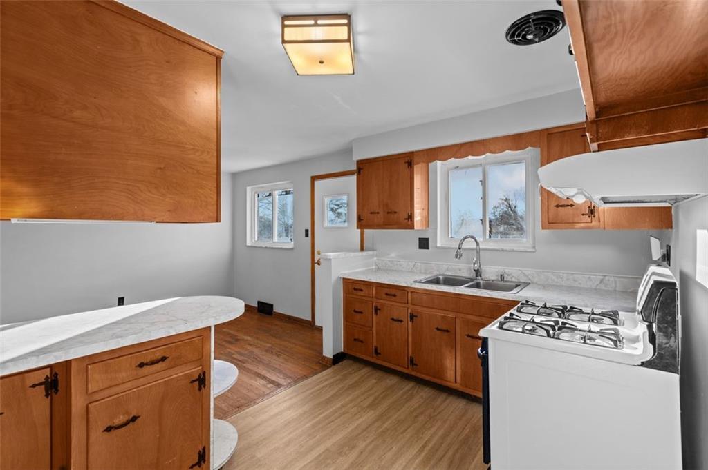 1210 Linden Street Cheswick, PA 15024 - Photo 8 of 31 a kitchen with stainless steel appliances granite countertop a sink stove and refrigerator