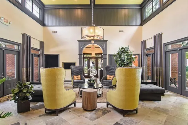 a view of a living room and entryway