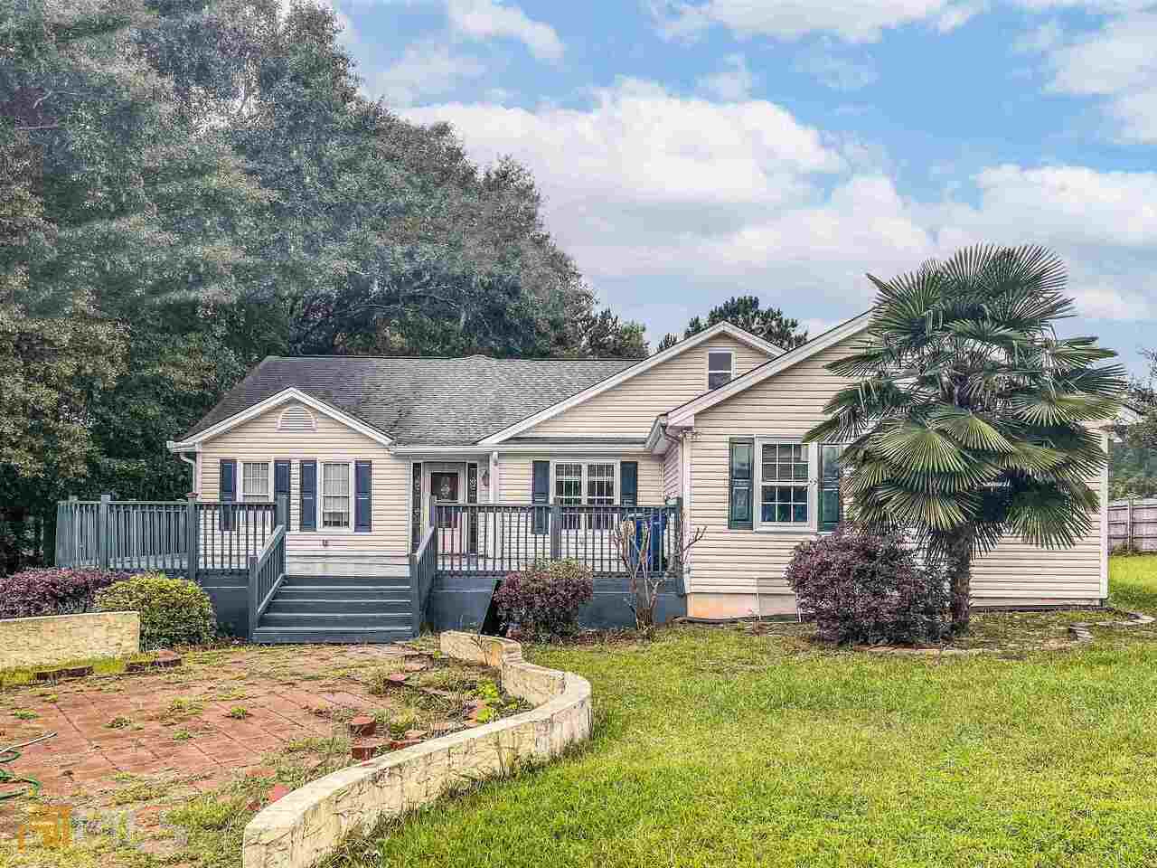 3025 Jonesboro Road Hampton, GA 30228 - Photo 1 of 1 a view of a house with a yard and large tree
