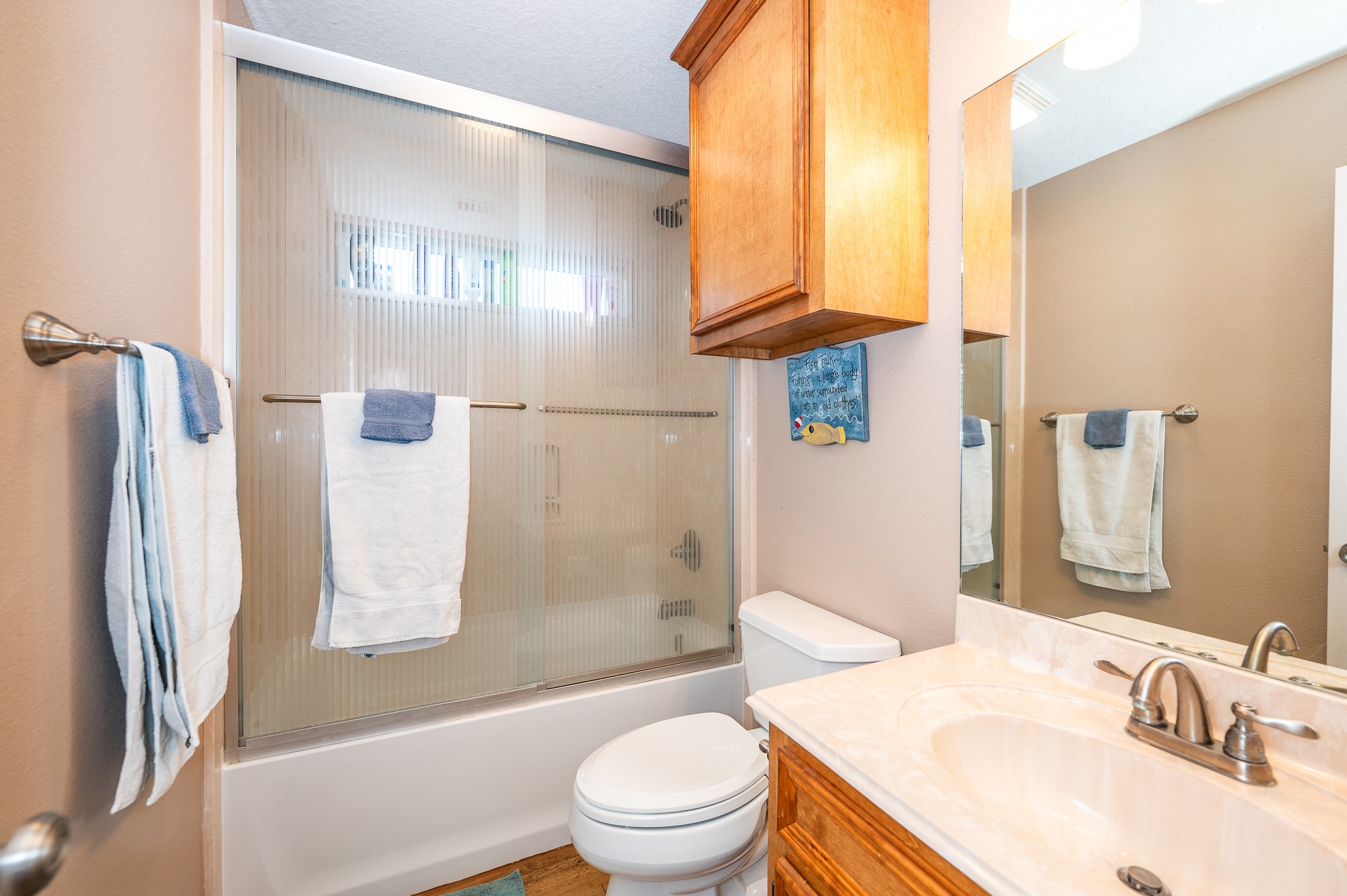 115 Albacore Street Sargent, TX 77414 - Photo 11 of 29 a bathroom with a sink toilet and shower