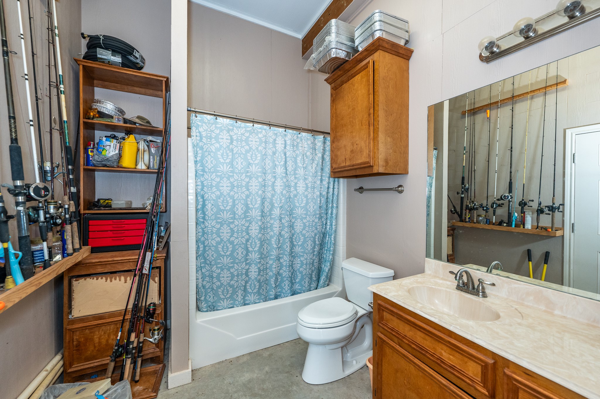 115 Albacore Street Sargent, TX 77414 - Photo 22 of 29 a bathroom with a sink toilet and shower