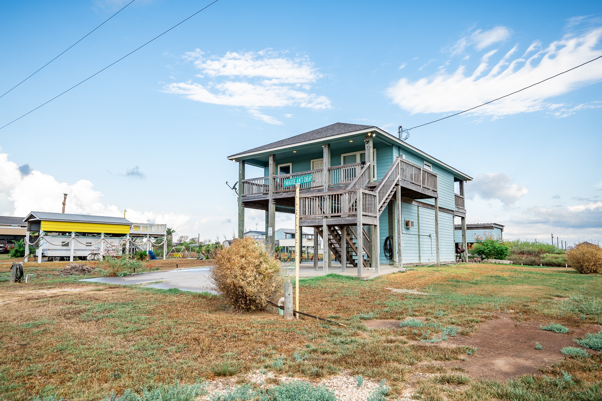 115 Albacore Street Sargent, TX 77414 - Photo 29 of 29 a view of a house with a yard