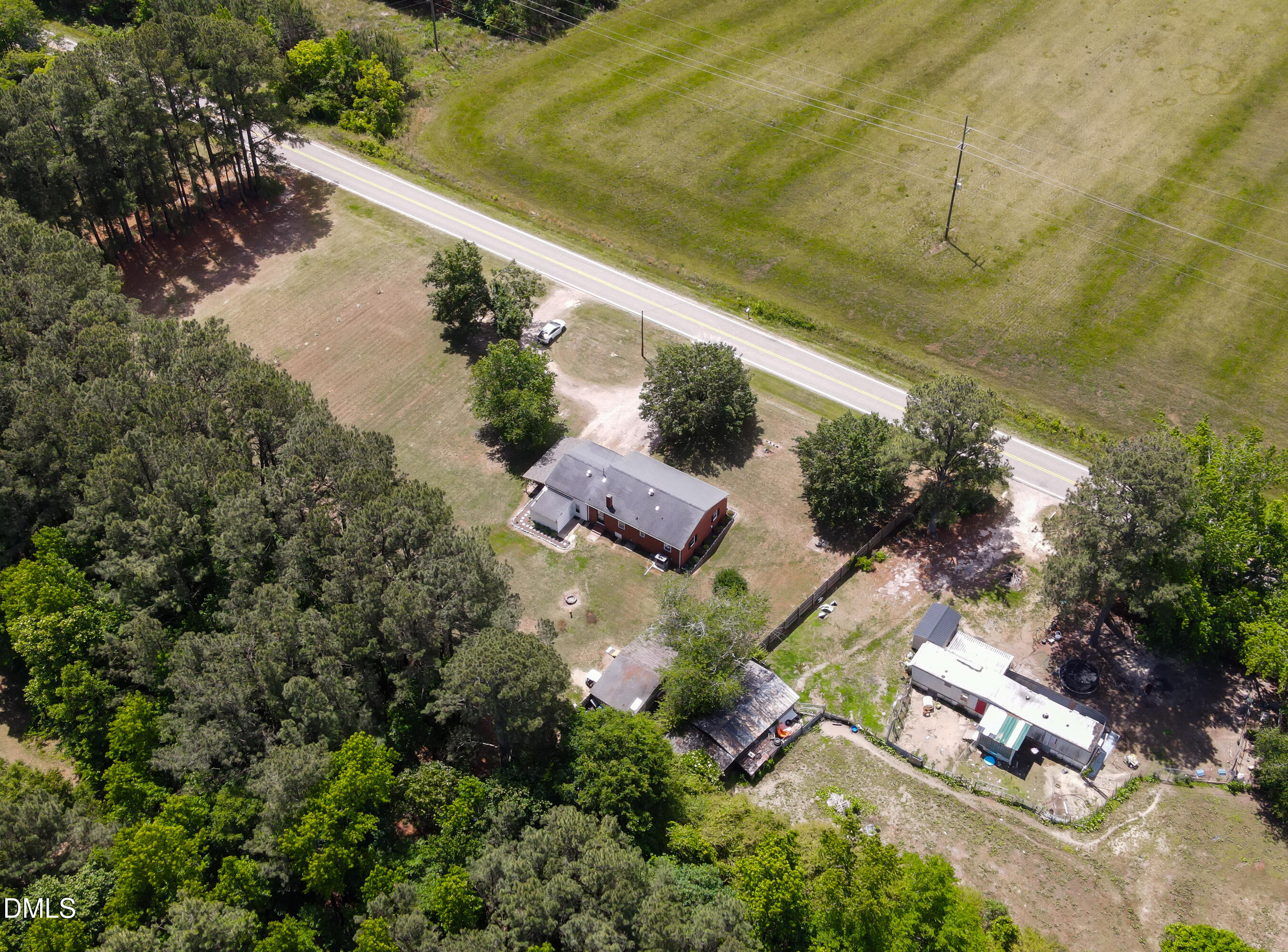 4967 Highway 581 Spring Hope, NC 27882 - Photo 39 of 44 an aerial view of residential house with outdoor space and lake view