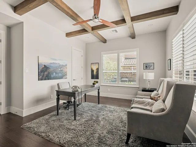 a living room with furniture a window and a table