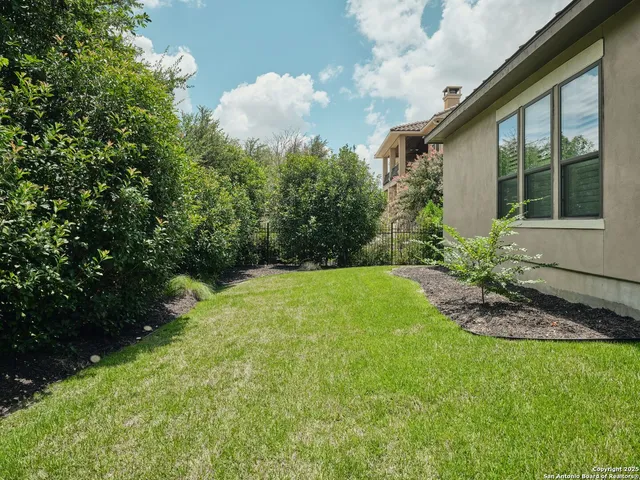 an aerial view of residential house with outdoor space and swimming pool