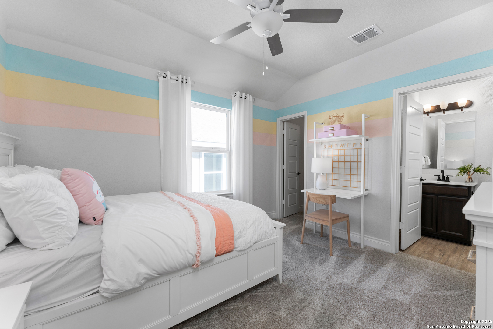 4036 Paddock Trail Seguin, TX 78155 - Photo 2 of 15 a bedroom with a bed and a chandelier fan