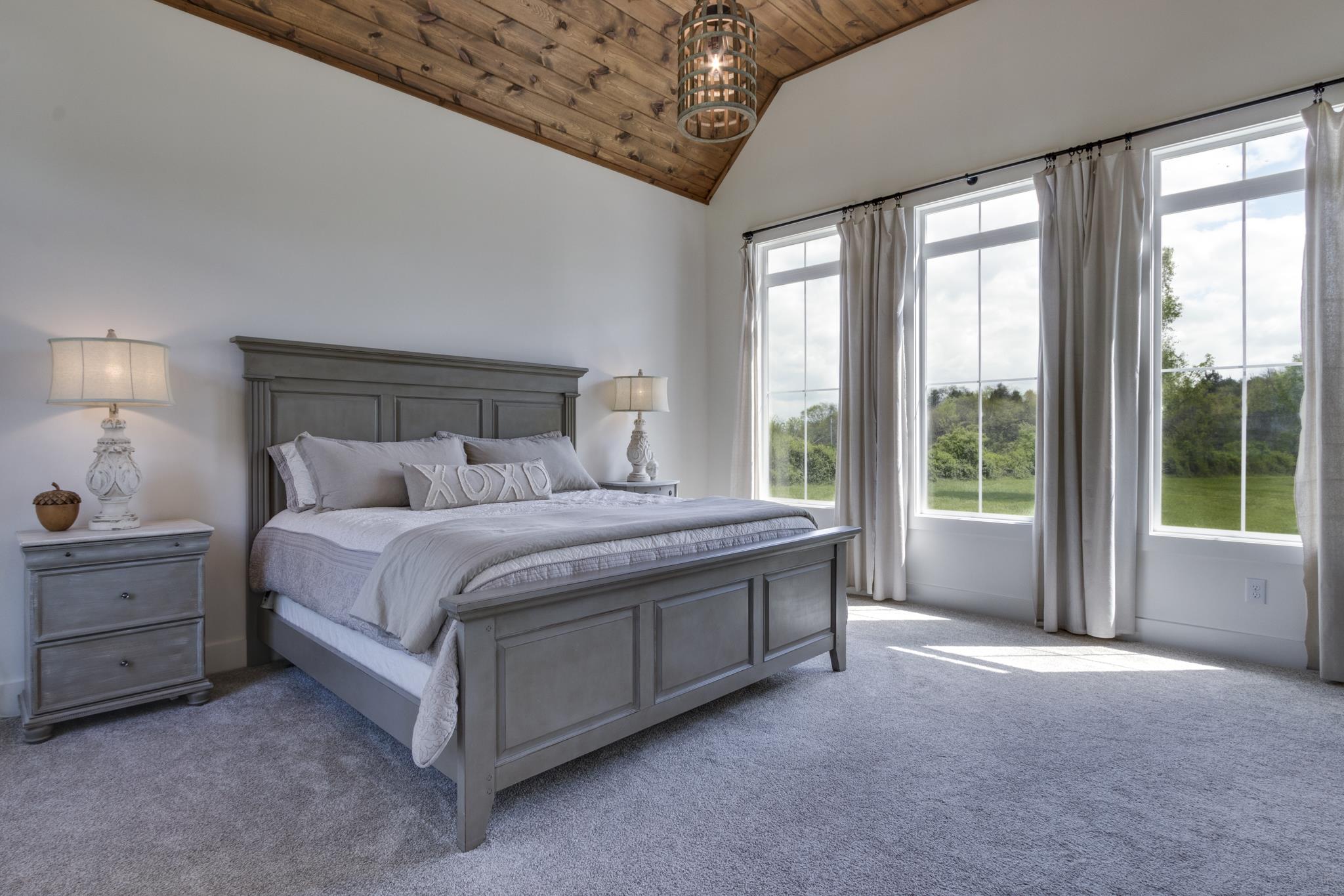 1024 Franklin Road Gallatin, TN 37066 - Photo 10 of 28 a bed sitting in a bedroom next to a window