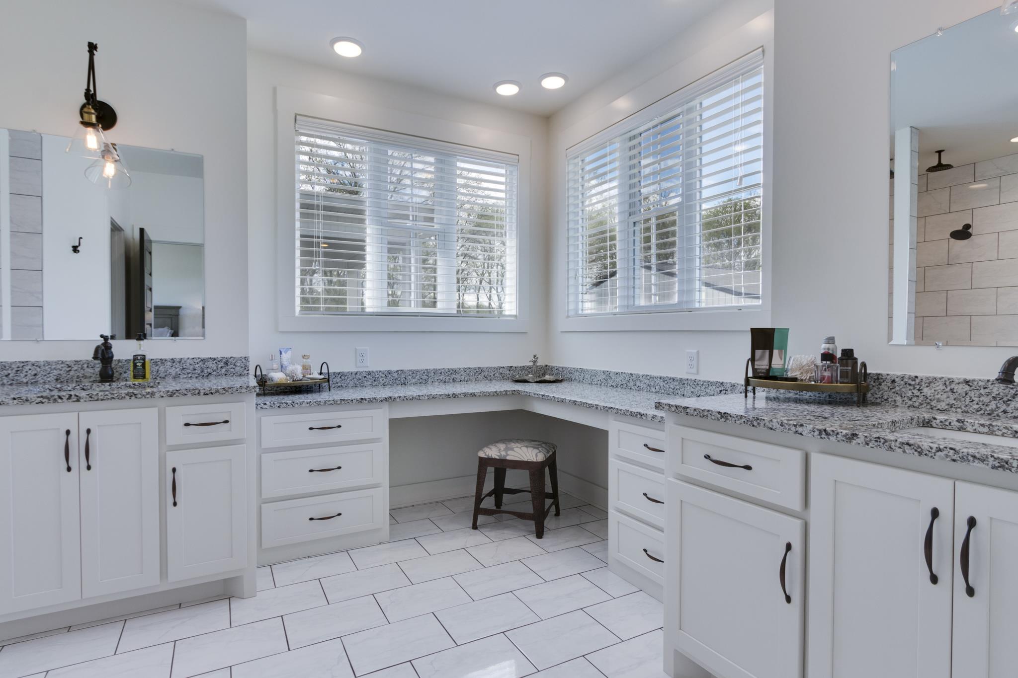 1024 Franklin Road Gallatin, TN 37066 - Photo 11 of 28 a kitchen with granite countertop white cabinets white appliances with a sink and dishwasher