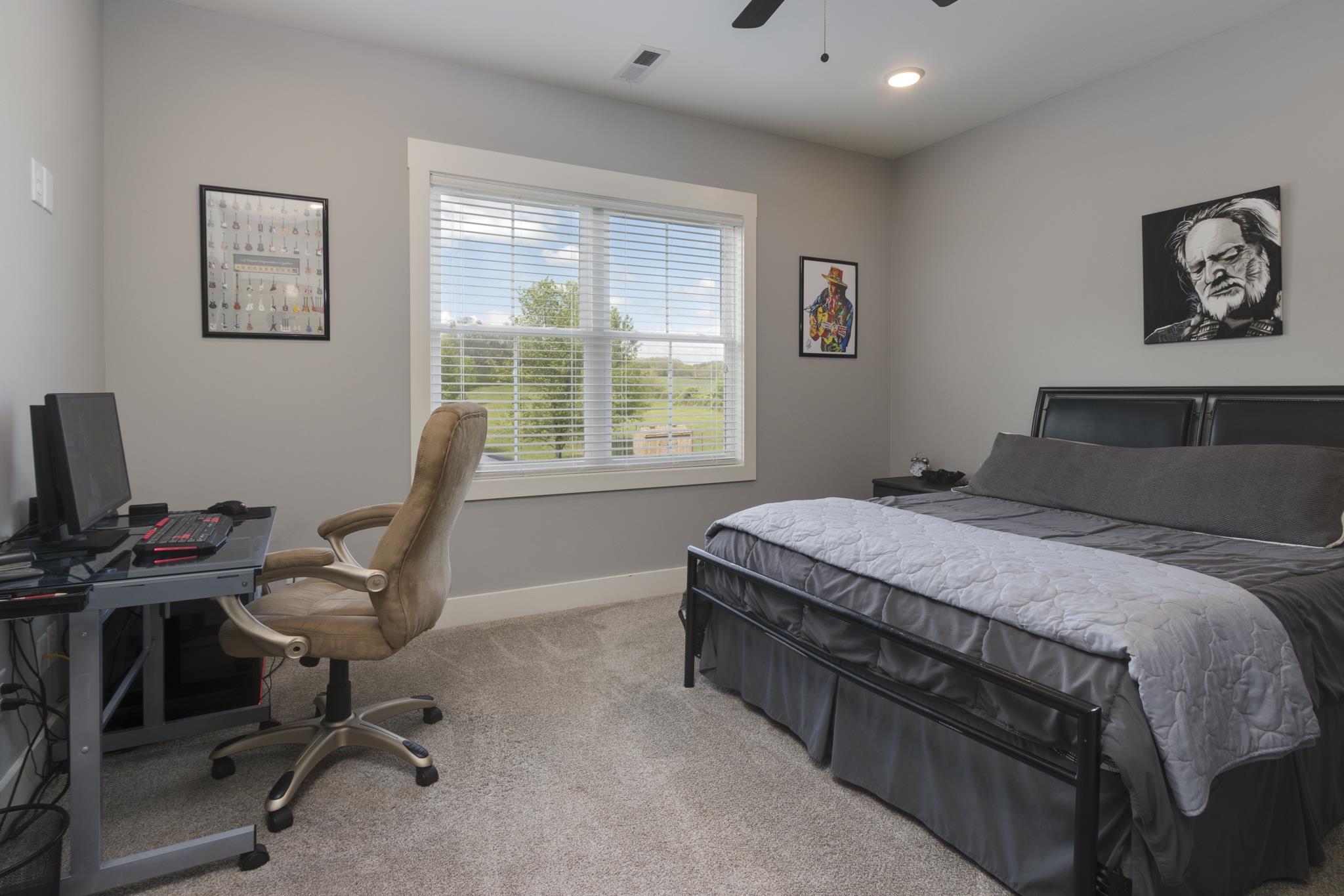 1024 Franklin Road Gallatin, TN 37066 - Photo 16 of 28 a bedroom with a large bed and a desk