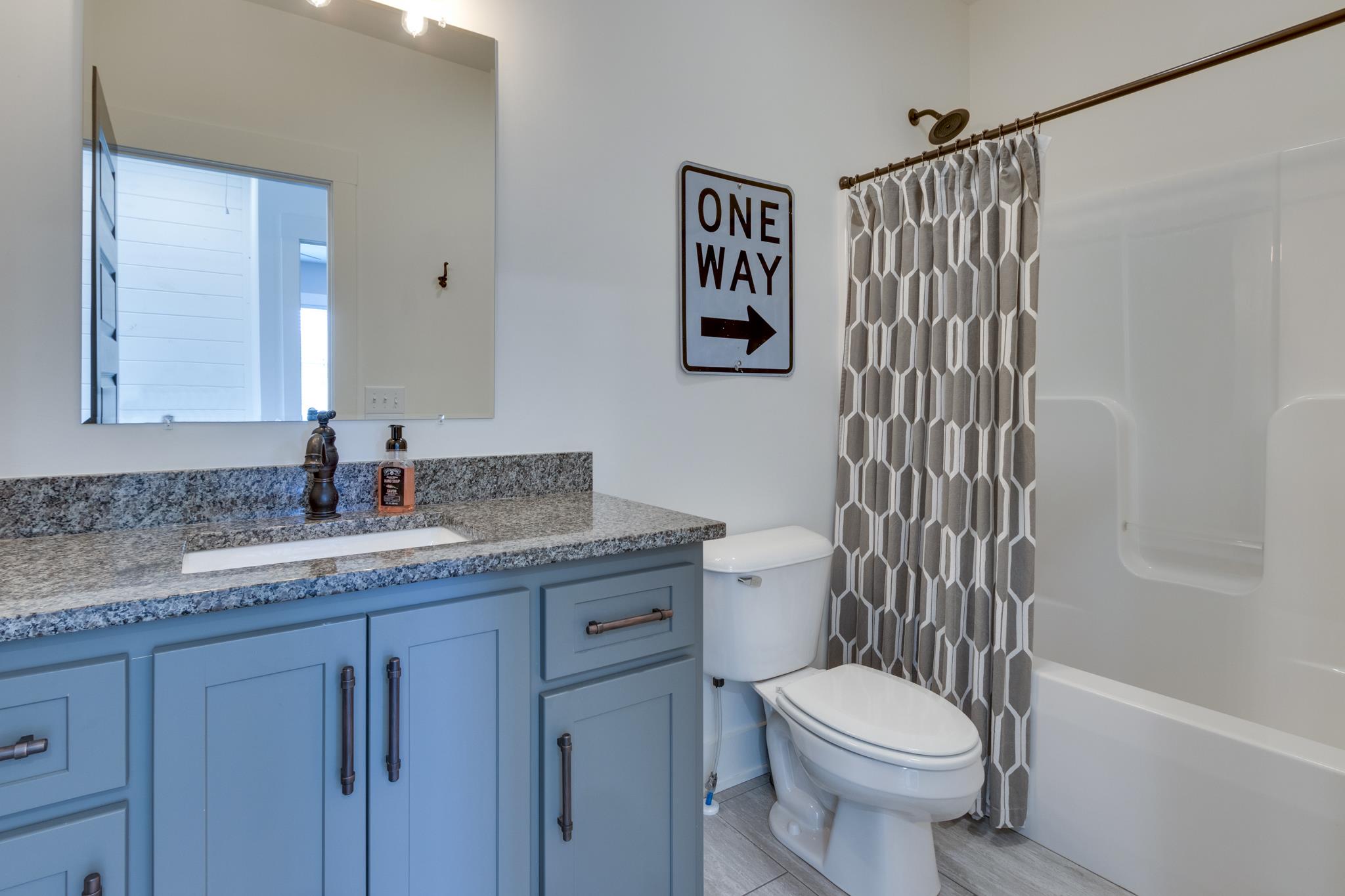 1024 Franklin Road Gallatin, TN 37066 - Photo 17 of 28 a bathroom with a granite countertop toilet sink and shower