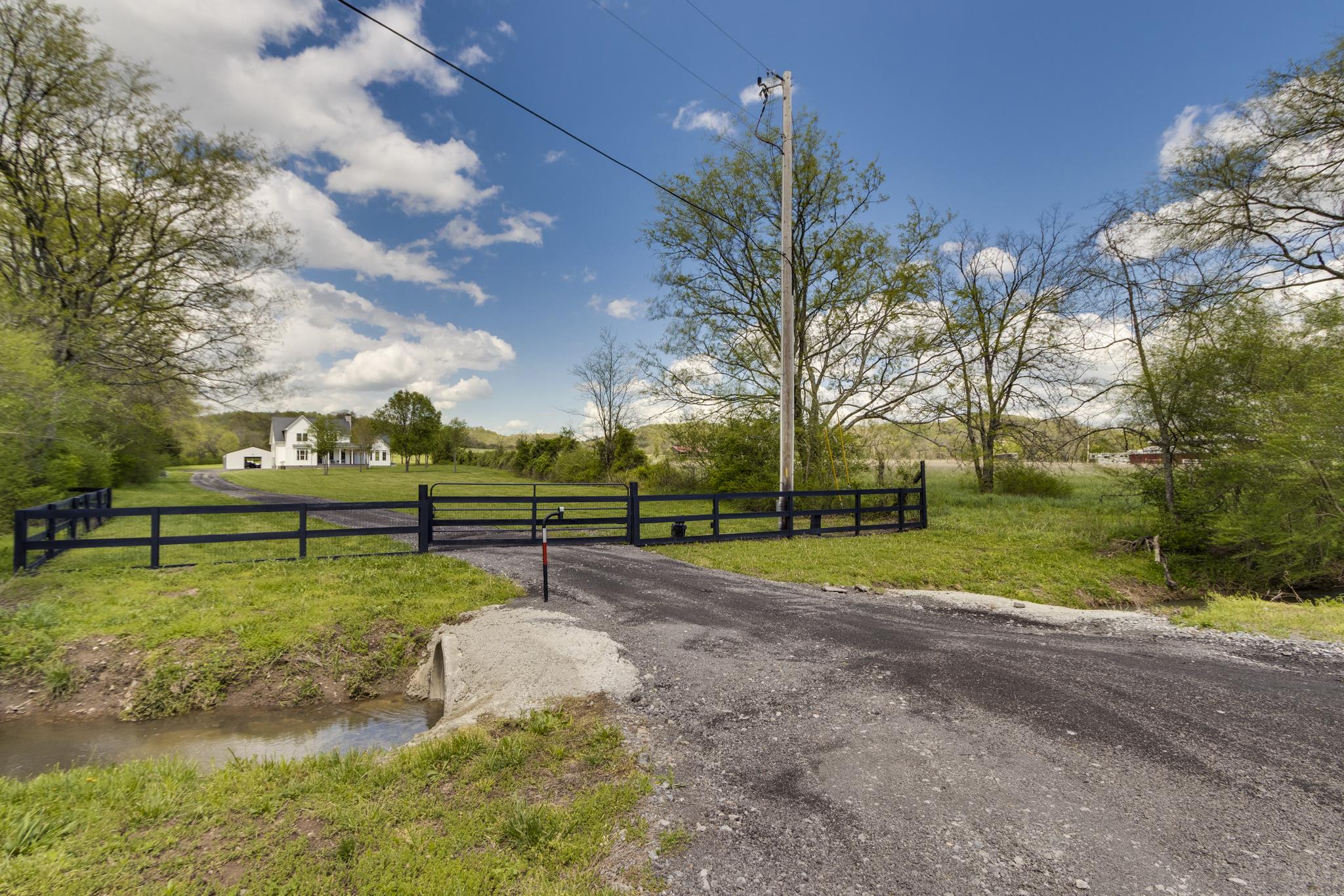 1024 Franklin Road Gallatin, TN 37066 - Photo 2 of 28 a view of backyard with swimming pool and trees