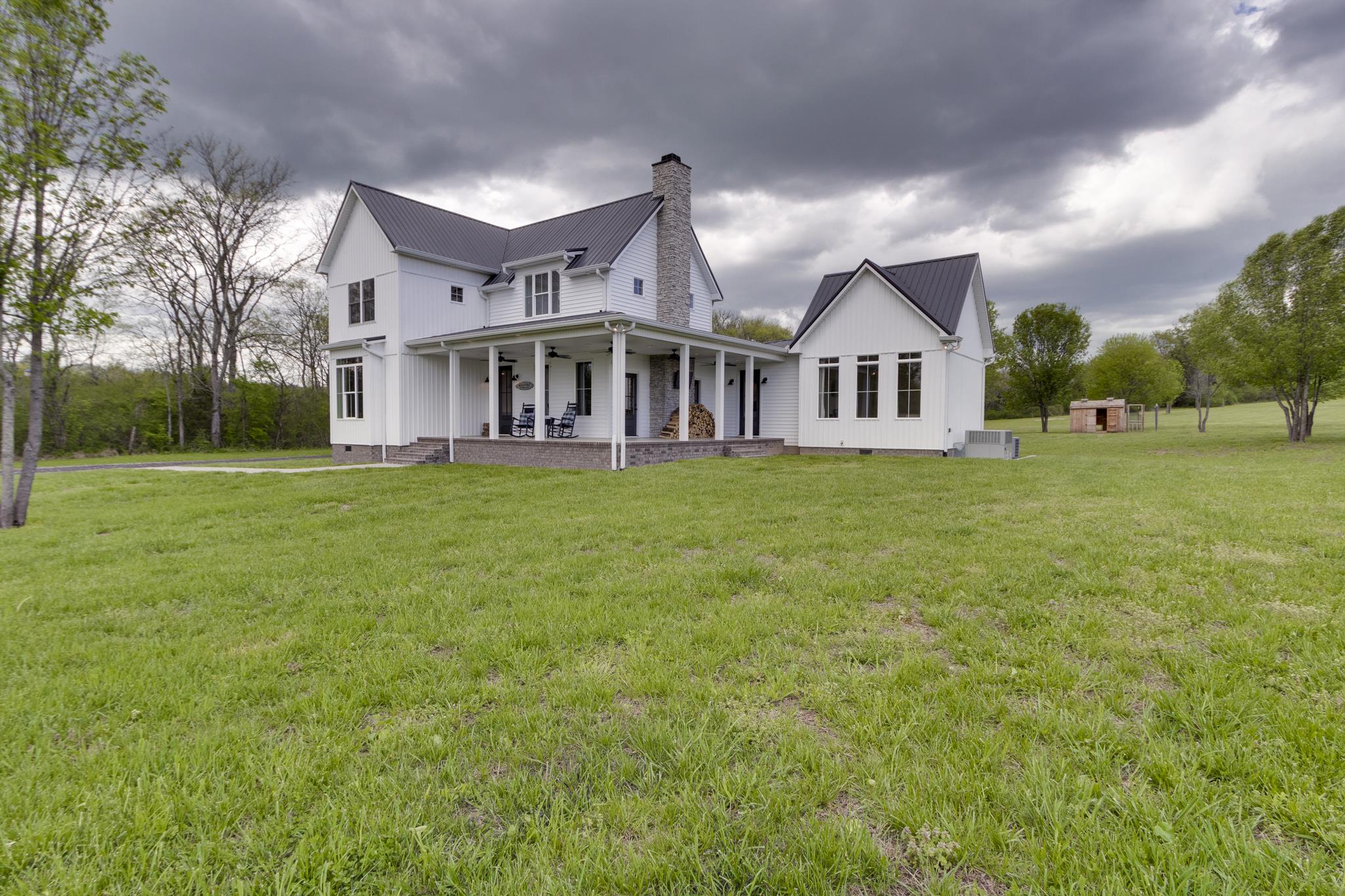 1024 Franklin Road Gallatin, TN 37066 - Photo 3 of 28 a view of a house with a big yard and large trees