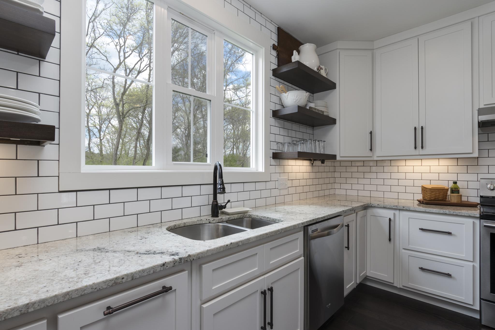 1024 Franklin Road Gallatin, TN 37066 - Photo 6 of 28 a kitchen with white cabinets and a sink
