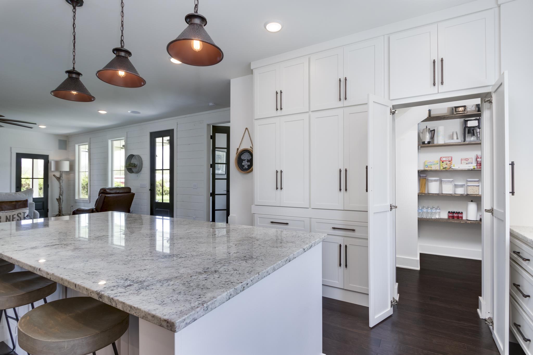 1024 Franklin Road Gallatin, TN 37066 - Photo 7 of 28 a kitchen with stainless steel appliances granite countertop a kitchen island a stove and white cabinets