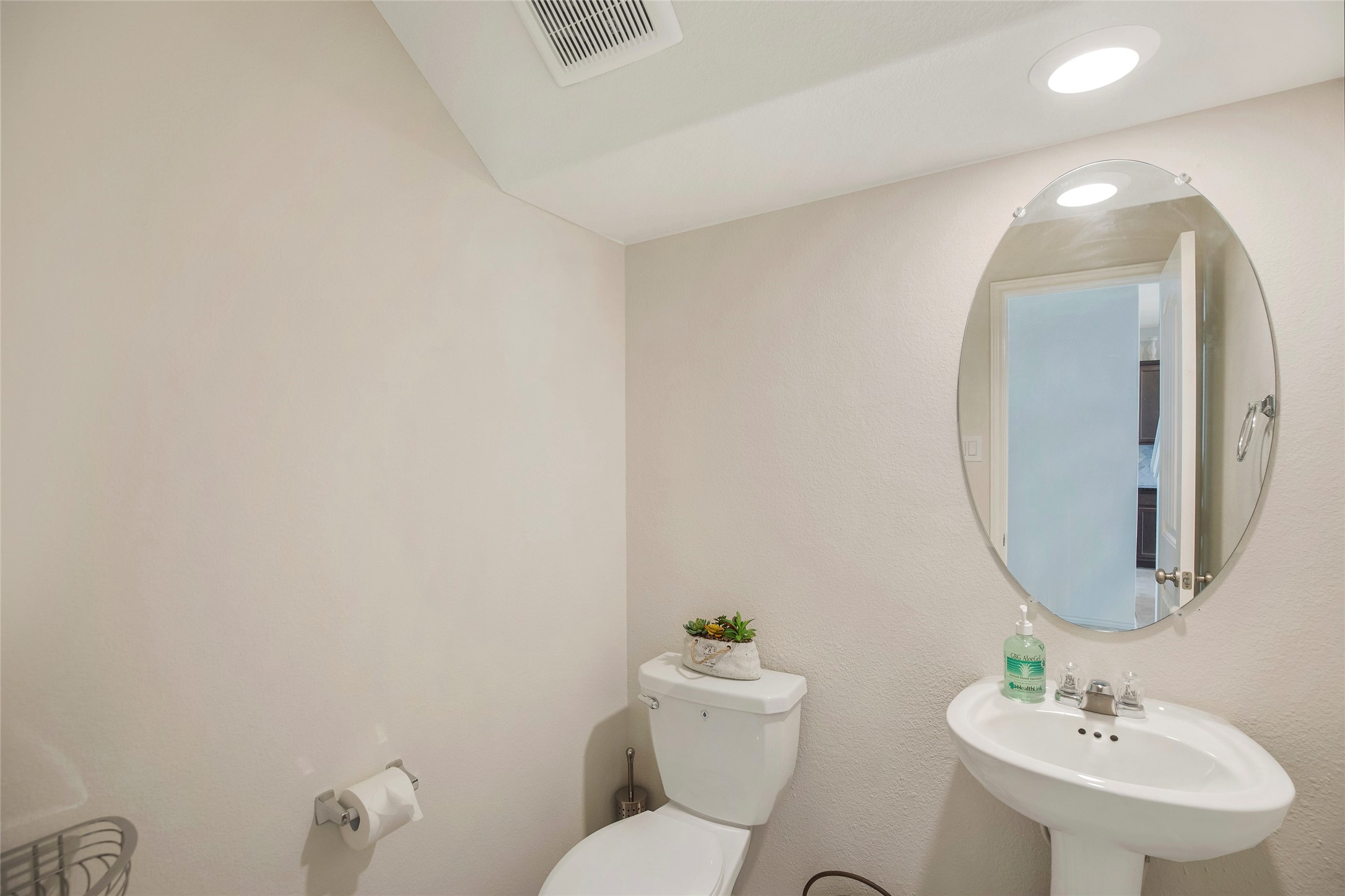 4519 Whitehaven Ridge Way Porter, TX 77365 - Photo 11 of 35 a bathroom with a sink mirror and toilet